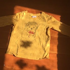 Girls yellow long sleeve shirt.